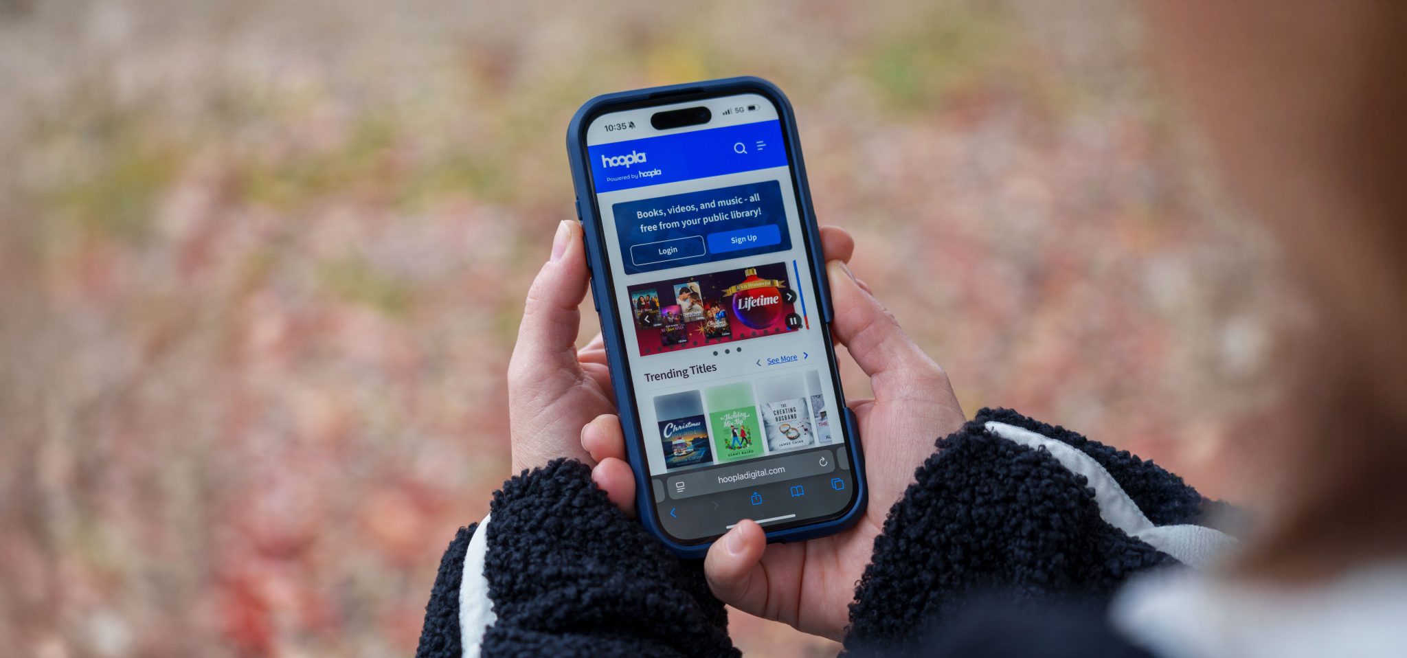 User using Hoopla app on phone